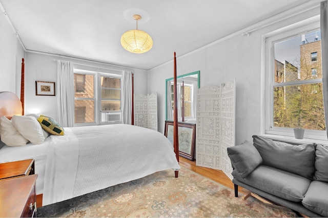 30 Bogardus Pl Unit 2B, New York City, NY 10040 - bedroom with multiple windows, ornamental molding, and wood finished floors