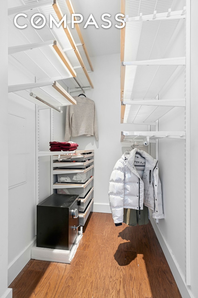 spacious closet featuring wood finished floors