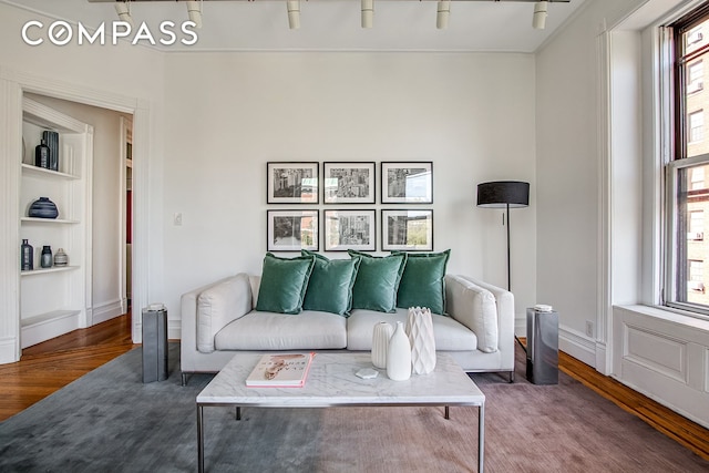 391/2 Washington Sq S Unit 9, New York City, NY 10012 - living area with wood finished floors, built in shelves, and plenty of natural light