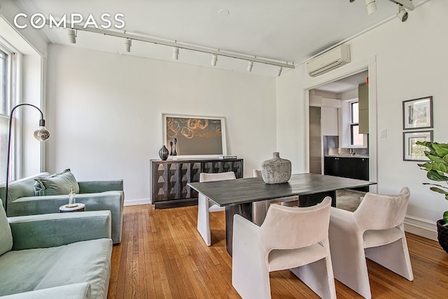 391/2 Washington Sq S Unit 9, New York City, NY 10012 - dining space featuring track lighting, an AC wall unit, and healthy amount of natural light