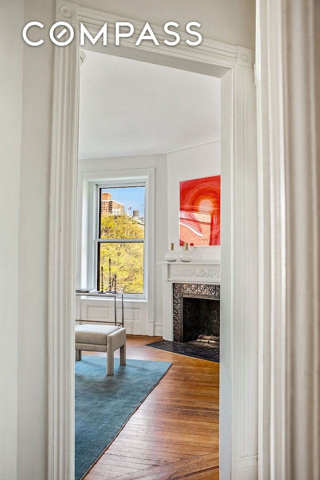 391/2 Washington Sq S Unit 9, New York City, NY 10012 - unfurnished living room with wood finished floors and a fireplace with flush hearth