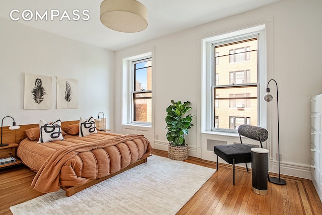 391/2 Washington Sq S Unit 9, New York City, NY 10012 - bedroom featuring multiple windows and light wood-style flooring