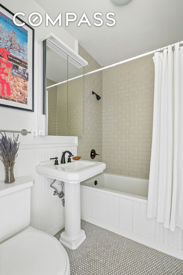 940 Fulton St Phd, Phd, New York City, NY 11238 - bathroom with shower / tub combo, toilet, and tile patterned floors
