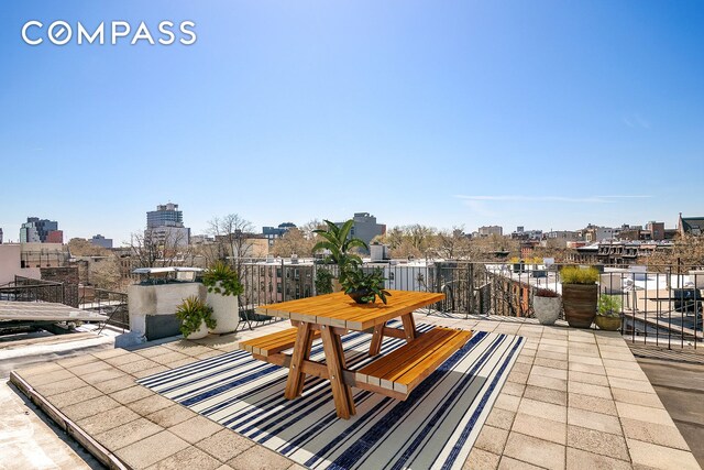 940 Fulton St Phd, Phd, New York City, NY 11238 - view of patio / terrace with a balcony and a view of city