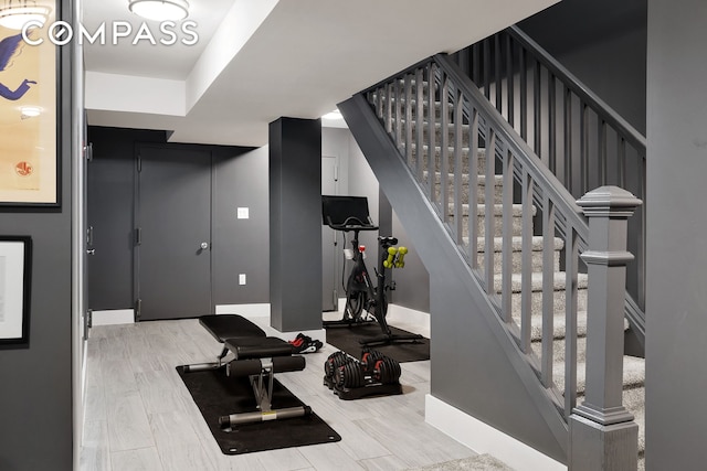 exercise room with baseboards