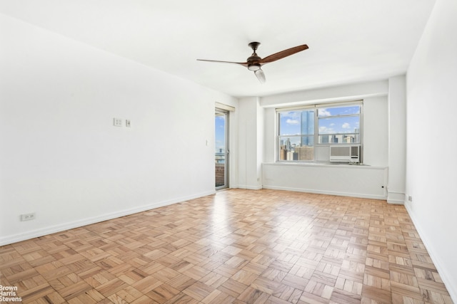 575 Grand St Unit E1806, New York City, NY 10002 - spare room featuring ceiling fan and baseboards