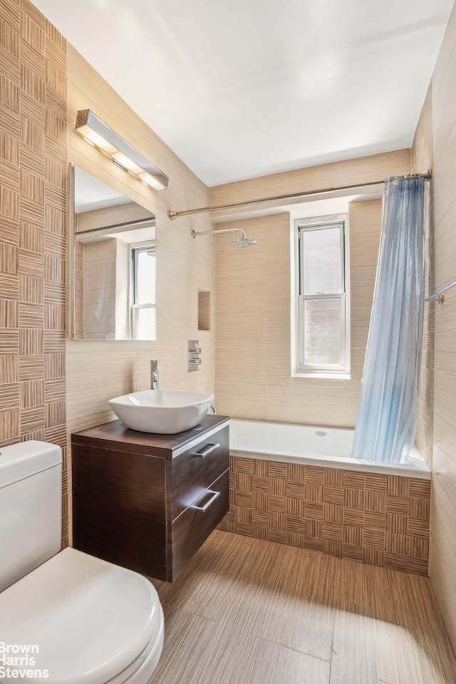 575 Grand St Unit E1806, New York City, NY 10002 - bathroom featuring toilet, shower / bath combo, vanity, and tile walls