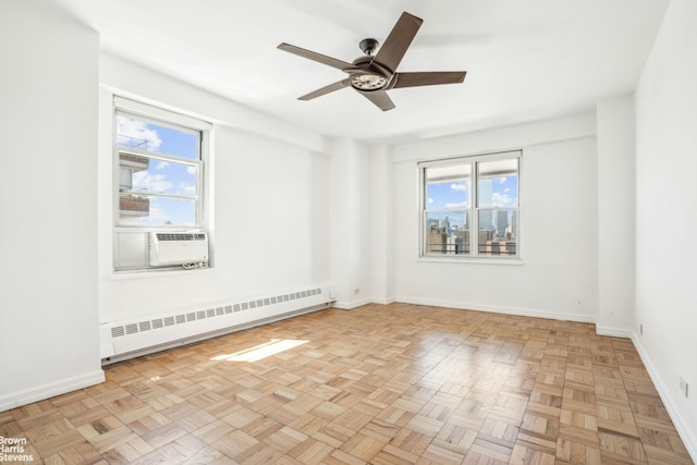 575 Grand St Unit E1806, New York City, NY 10002 - unfurnished room featuring a baseboard radiator, a ceiling fan, and cooling unit