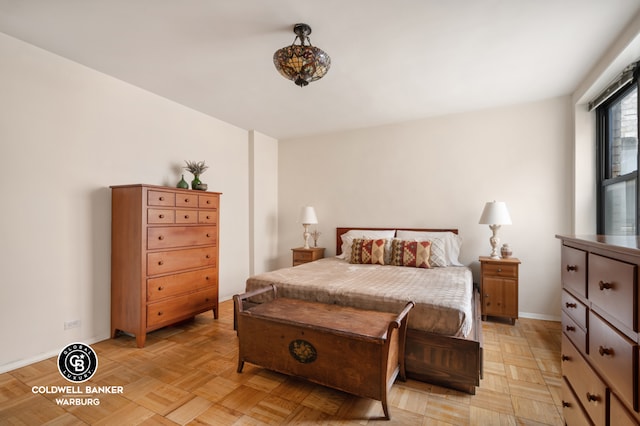 bedroom featuring baseboards