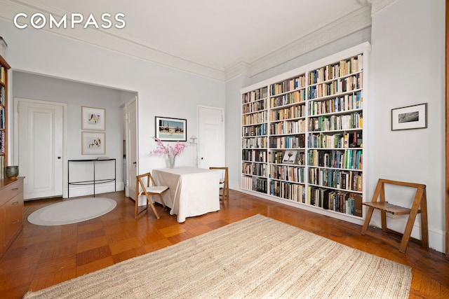 living area with ornamental molding