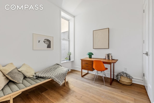 744 Park Pl Unit 4A, New York City, NY 11216 - bedroom featuring light wood-type flooring, multiple windows, an office area, and baseboards
