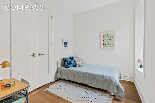 744 Park Pl Unit 4A, New York City, NY 11216 - bedroom featuring light wood finished floors and baseboards