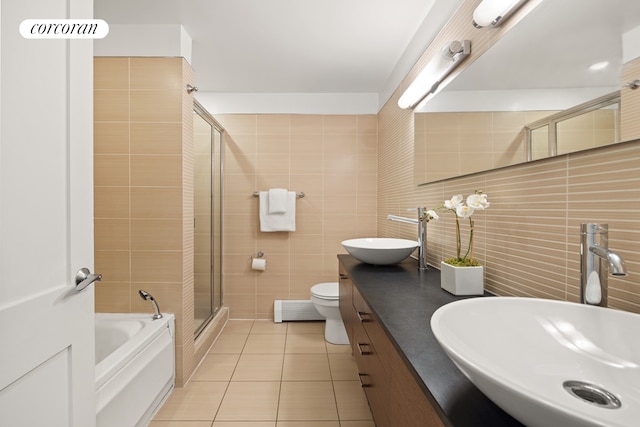 full bath featuring tile walls, tile patterned flooring, a shower stall, decorative backsplash, and double vanity