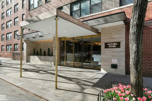 entrance to property with brick siding