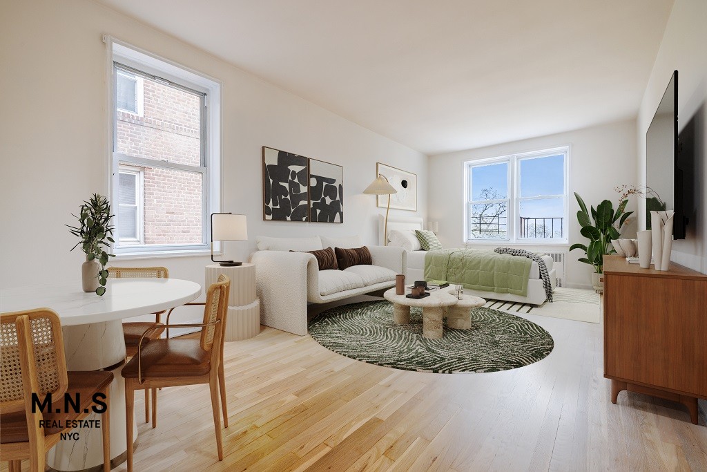 84-55 Daniels St Unit 5-E, New York City, NY 11435 - living room with wood finished floors
