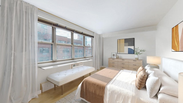 bedroom featuring light wood-style floors