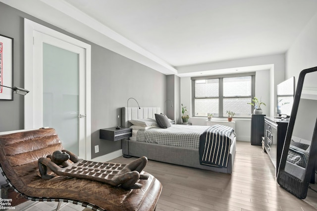 bedroom with light wood finished floors