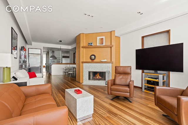 244 W 23rd St Unit 3A, New York City, NY 10011 - living area with wood finished floors and a fireplace