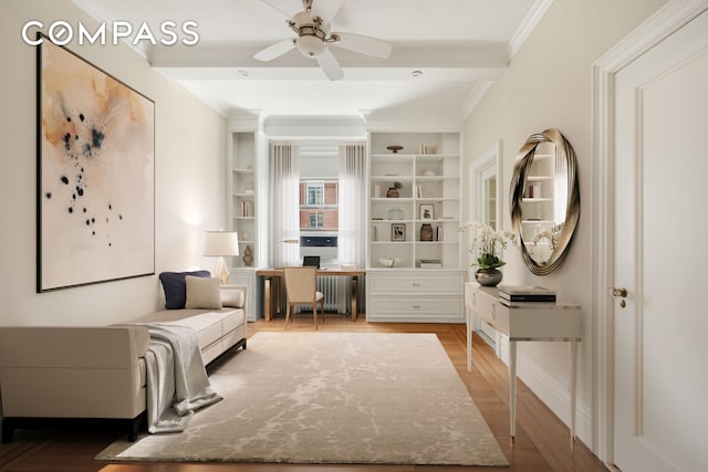 530 W End Ave Unit 9B, New York City, NY 10024 - living area with ornamental molding, an office area, wood finished floors, a ceiling fan, and radiator heating unit