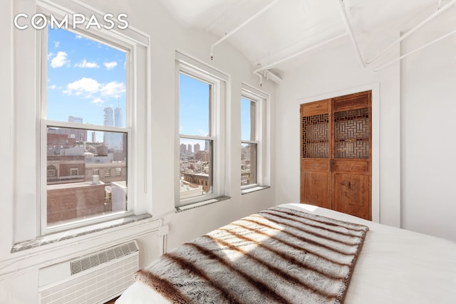 543 Broadway Ph Ph, New York City, NY 10012 - bedroom featuring a view of skyline and vaulted ceiling
