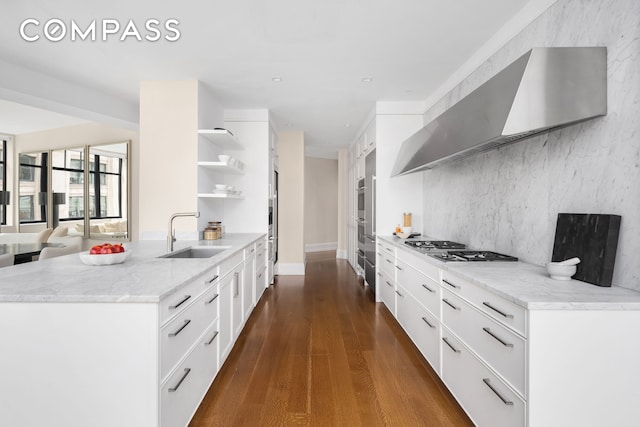 kitchen with white cabinets, dark wood-style flooring, open shelves, a sink, and stainless steel gas cooktop