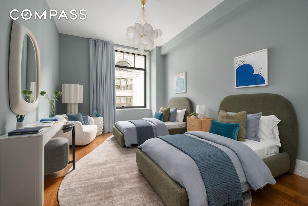 10 Madison Sq W Unit 12D, New York City, NY 10010 - bedroom featuring a chandelier and wood finished floors