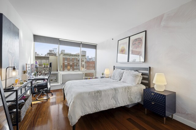 310 E Houston St Phc, Phc, New York City, NY 10002 - bedroom featuring wood finished floors and a desk