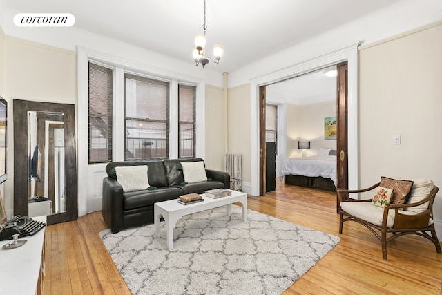 611 W 111th St Unit 27, New York City, NY 10025 - living area featuring light wood-type flooring and a chandelier