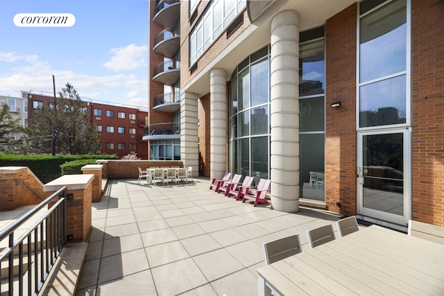 view of patio featuring outdoor dining area