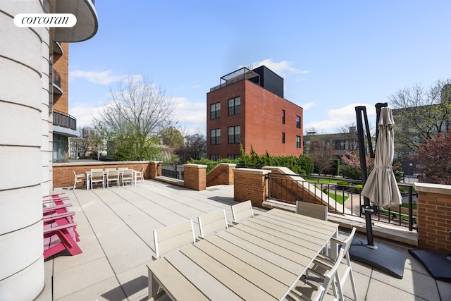 view of patio / terrace with outdoor dry bar and outdoor dining space