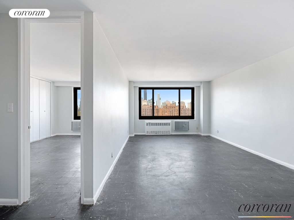 spare room featuring baseboards