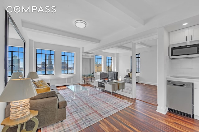living room with beam ceiling, wood finished floors, baseboards, radiator, and recessed lighting