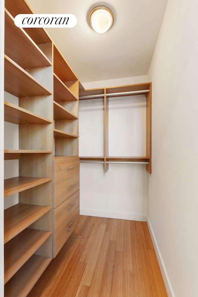 450 W 17th St Unit 2408, New York City, NY 10011 - walk in closet with light wood-style floors