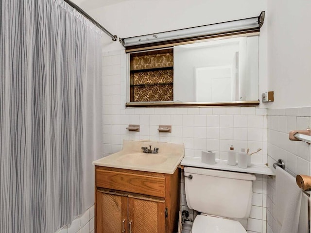 bathroom with tile walls, toilet, shower / bath combination with curtain, and vanity