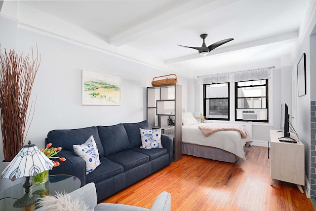 457 W 57th St Unit 911, New York City, NY 10019 - bedroom with beam ceiling, hardwood / wood-style flooring, cooling unit, and ceiling fan