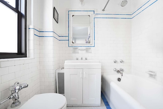 457 W 57th St Unit 911, New York City, NY 10019 - bathroom with tile walls, toilet, and vanity
