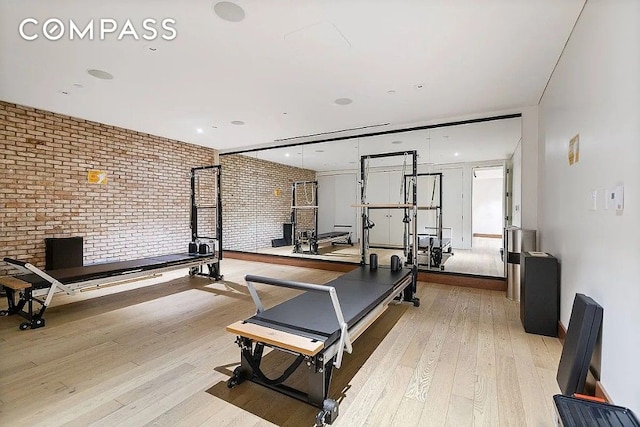 550 Vanderbilt Ave Unit 1508, New York City, NY 11238 - exercise room featuring brick wall and wood-type flooring