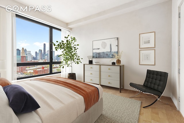 550 Vanderbilt Ave Unit 1508, New York City, NY 11238 - bedroom featuring a view of skyline and light wood-style flooring