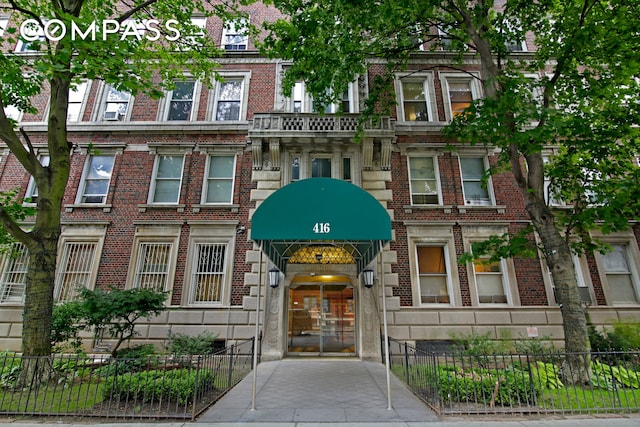 view of building exterior featuring fence private yard