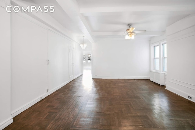 unfurnished living room with baseboards and ceiling fan with notable chandelier