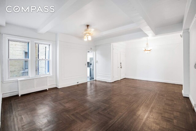 unfurnished room featuring radiator, beamed ceiling, a ceiling fan, and baseboards