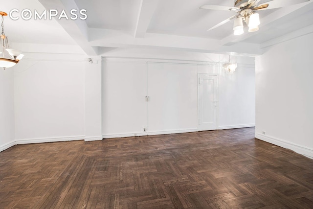 unfurnished room with beamed ceiling, baseboards, and ceiling fan with notable chandelier