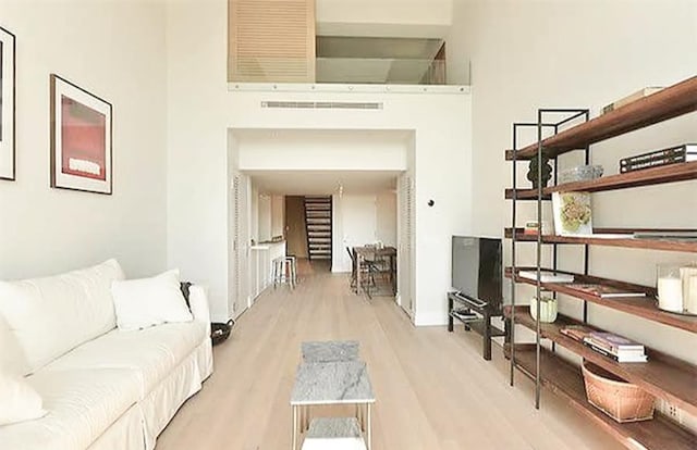 421 Hudson St Unit 305, New York City, NY 10014 - living room featuring wood finished floors