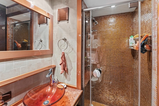 160 W 66th St Unit 34-G, New York City, NY 10023 - full bath with a shower stall, tile walls, and vanity