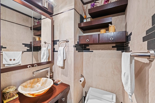 160 W 66th St Unit 34-G, New York City, NY 10023 - bathroom with tile walls, toilet, and vanity