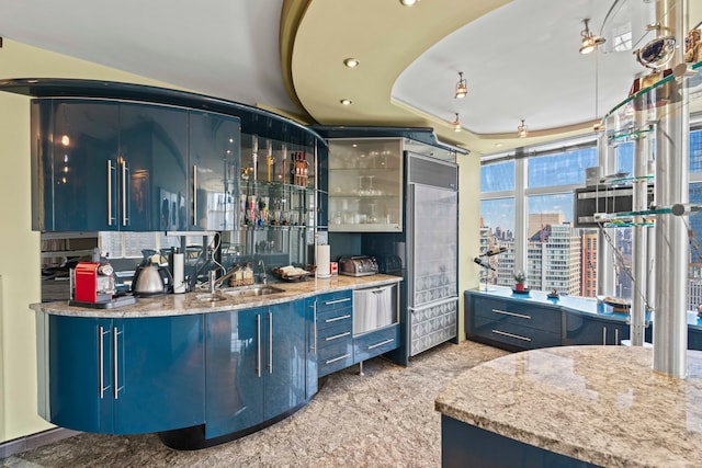 160 W 66th St Unit 34-G, New York City, NY 10023 - indoor wet bar featuring stainless steel built in fridge, a city view, recessed lighting, and a tray ceiling