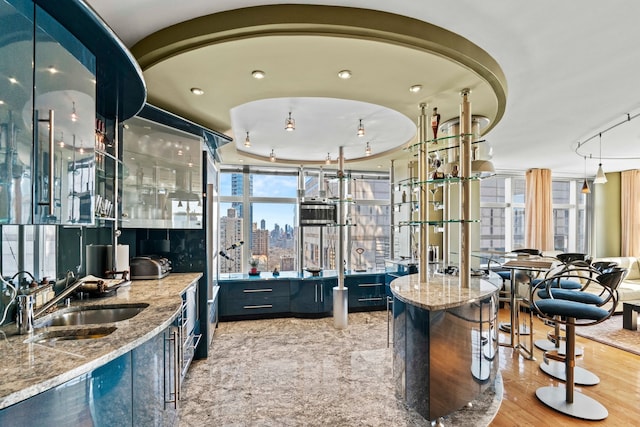 160 W 66th St Unit 34-G, New York City, NY 10023 - indoor wet bar with a skyline view and wood finished floors