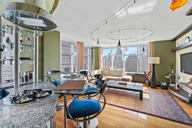160 W 66th St Unit 34-G, New York City, NY 10023 - dining room featuring wood finished floors and a wall of windows