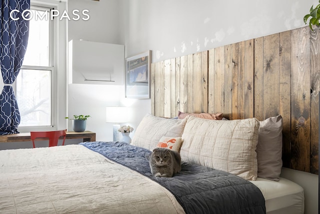 bedroom featuring multiple windows