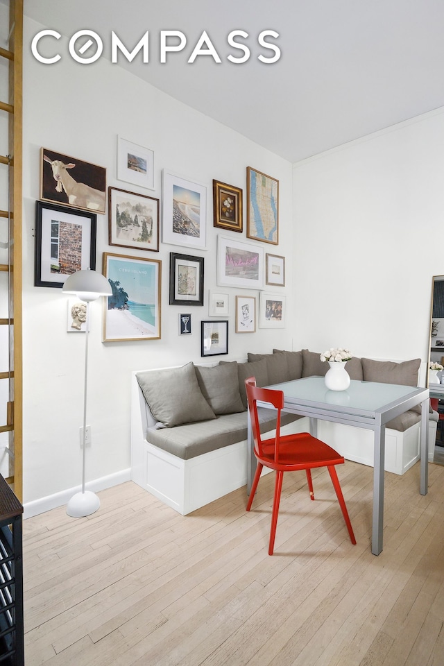 home office featuring hardwood / wood-style flooring and baseboards